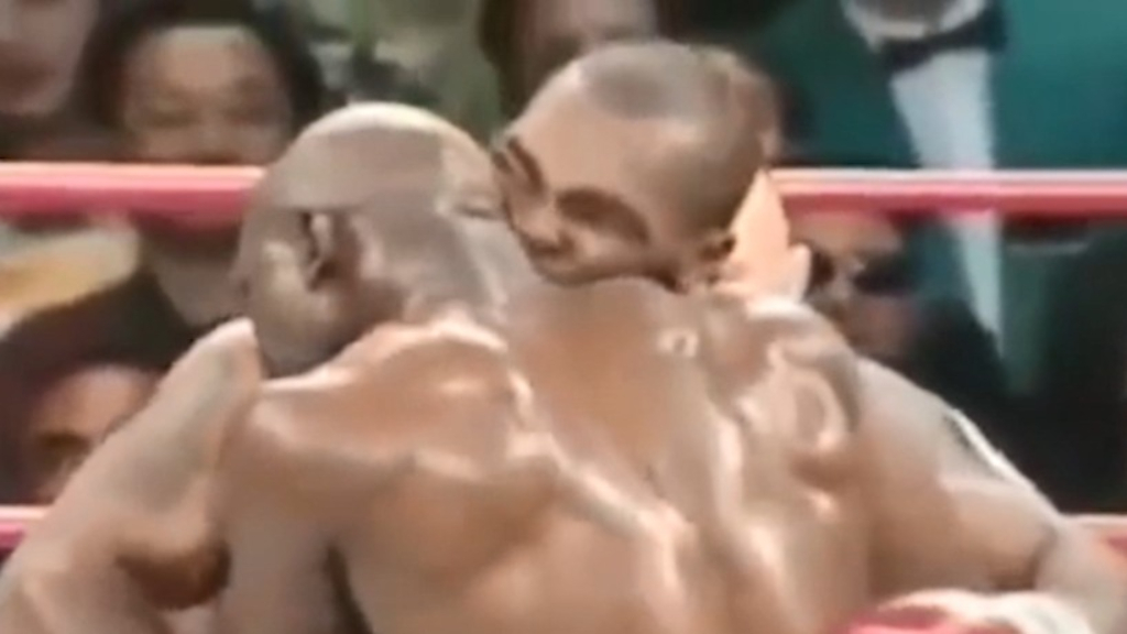 Tyson bites Holyfield's ear off