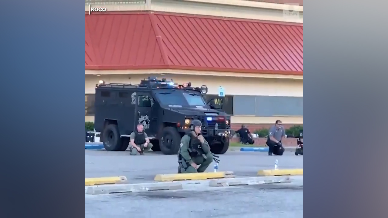 Oklahoma police kneel with protesters