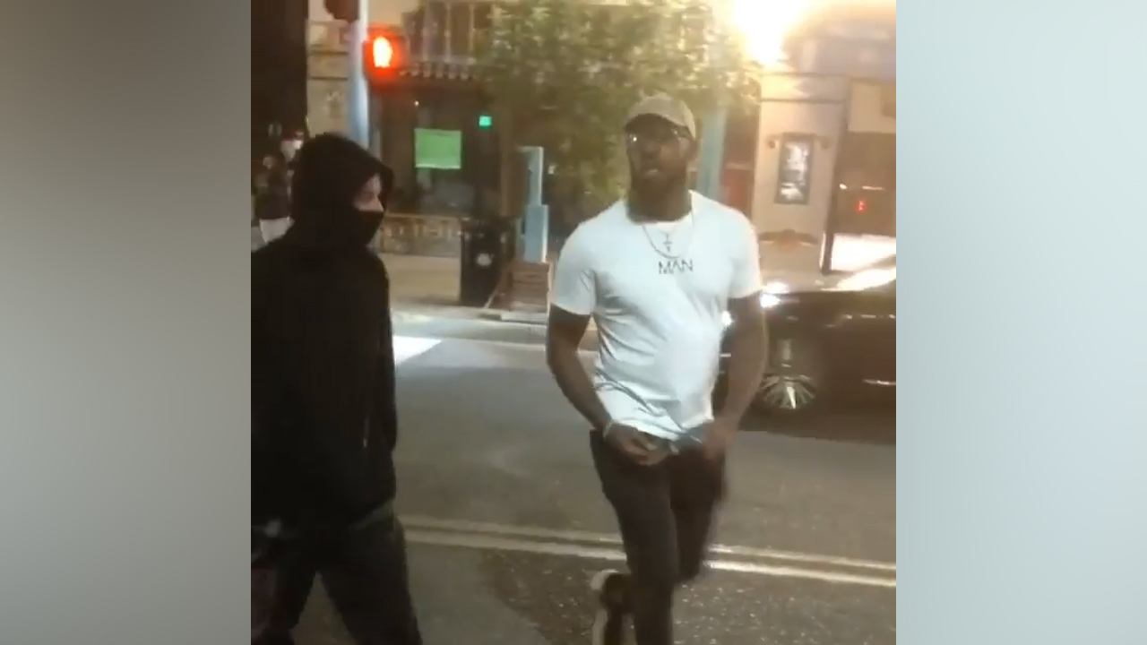 UFC fighter Jon Jones confronts potential vandals