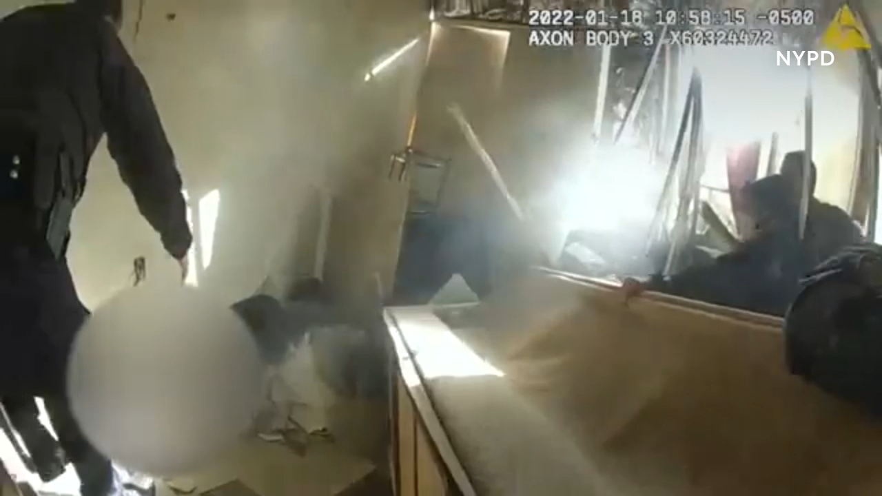 Woman's rescue from a burning building captured on NYPD body cam footage