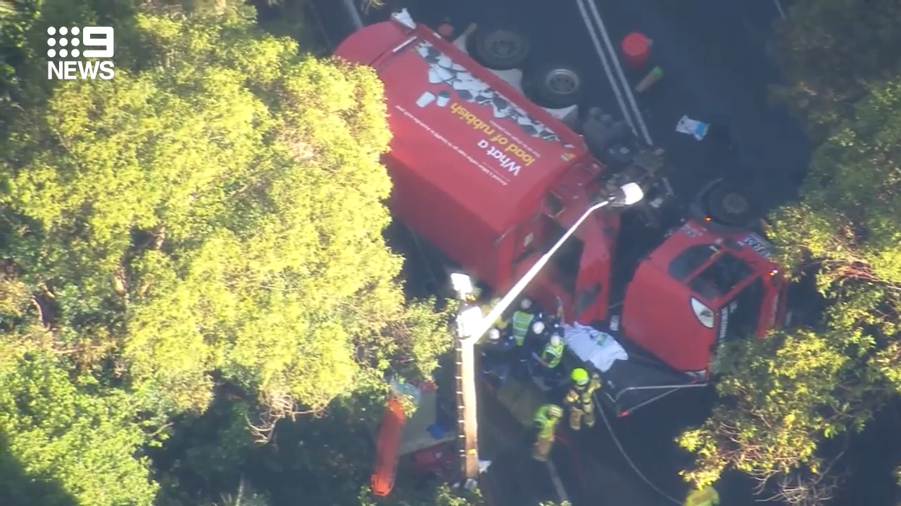 Driver trapped after truck crushes ute in crash