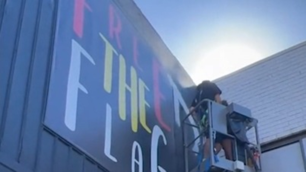 'Free the flag' billboard updated after historic deal