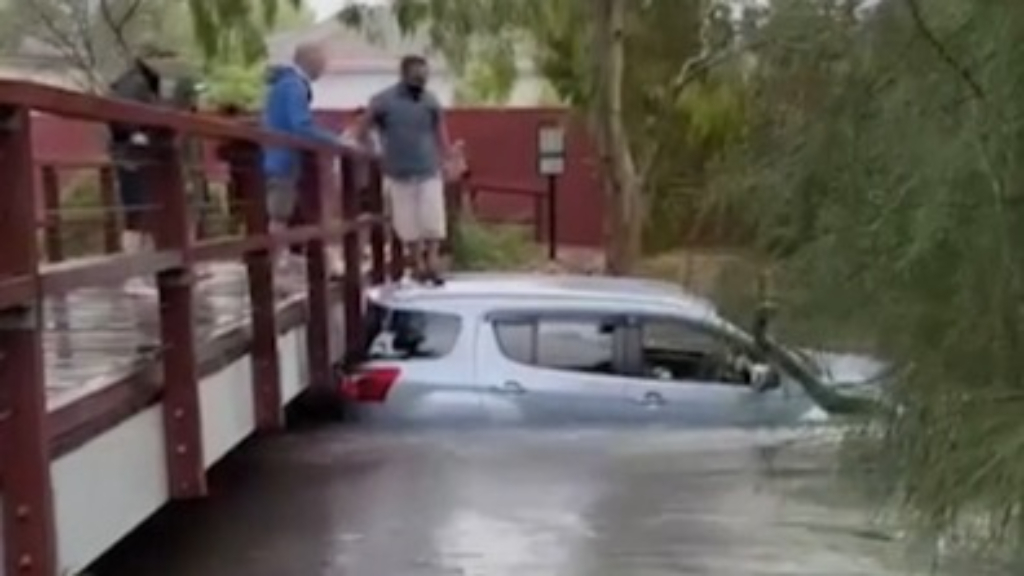 Melbourne Uber driver trapped in floodwaters