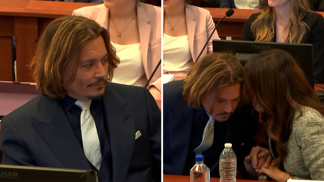 Johnny Depp speaks to his lawyer Camille Vasquez during trial