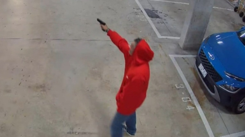 CCTV captures brazen footage of gun held at driver in Melbourne garage