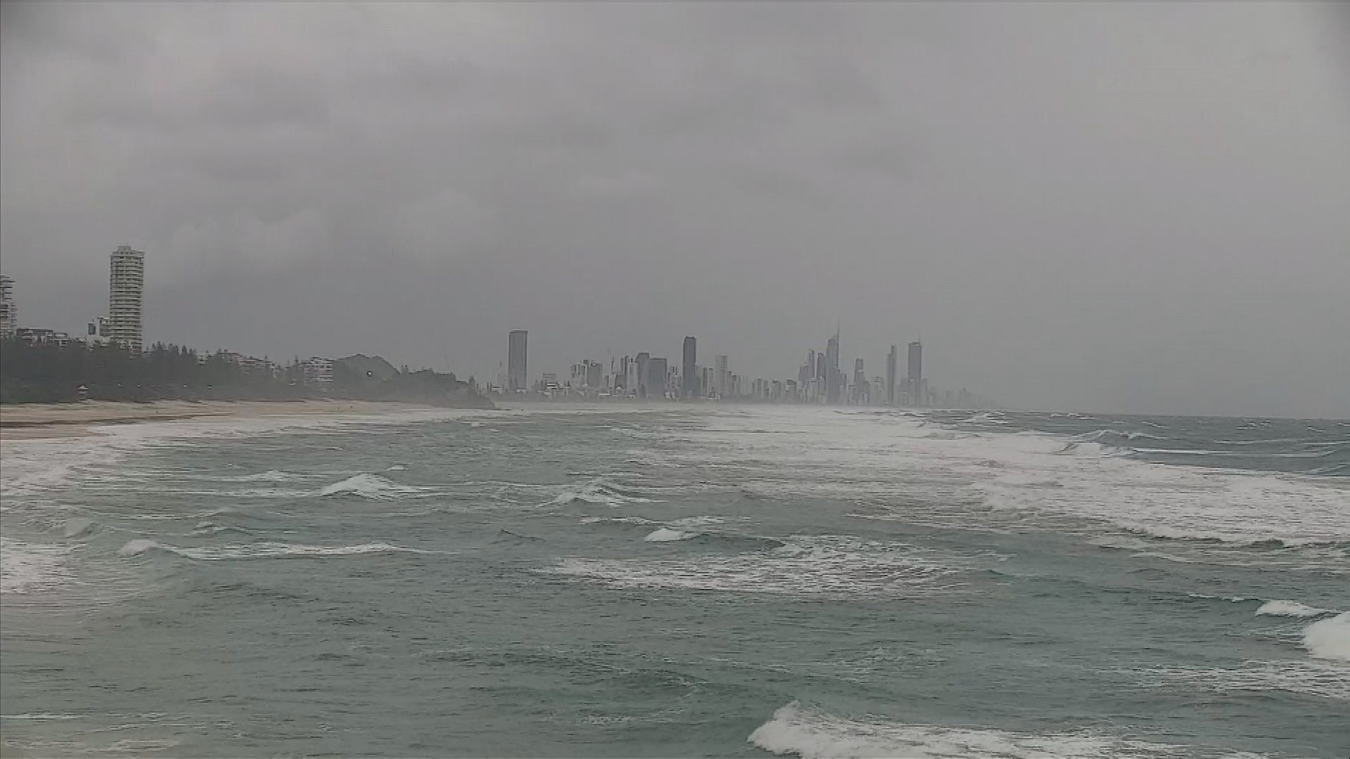 Queensland police are searching for a driver after his car was washed away in torrential rain – 9News