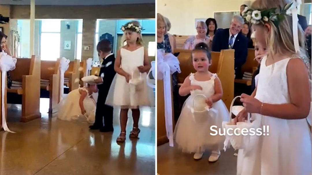 Adorable moment flower girl tries to clean the aisle