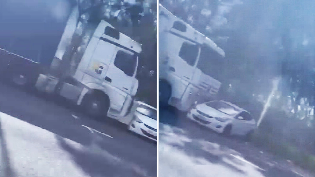 Truck pushes sideways car along Queensland highway