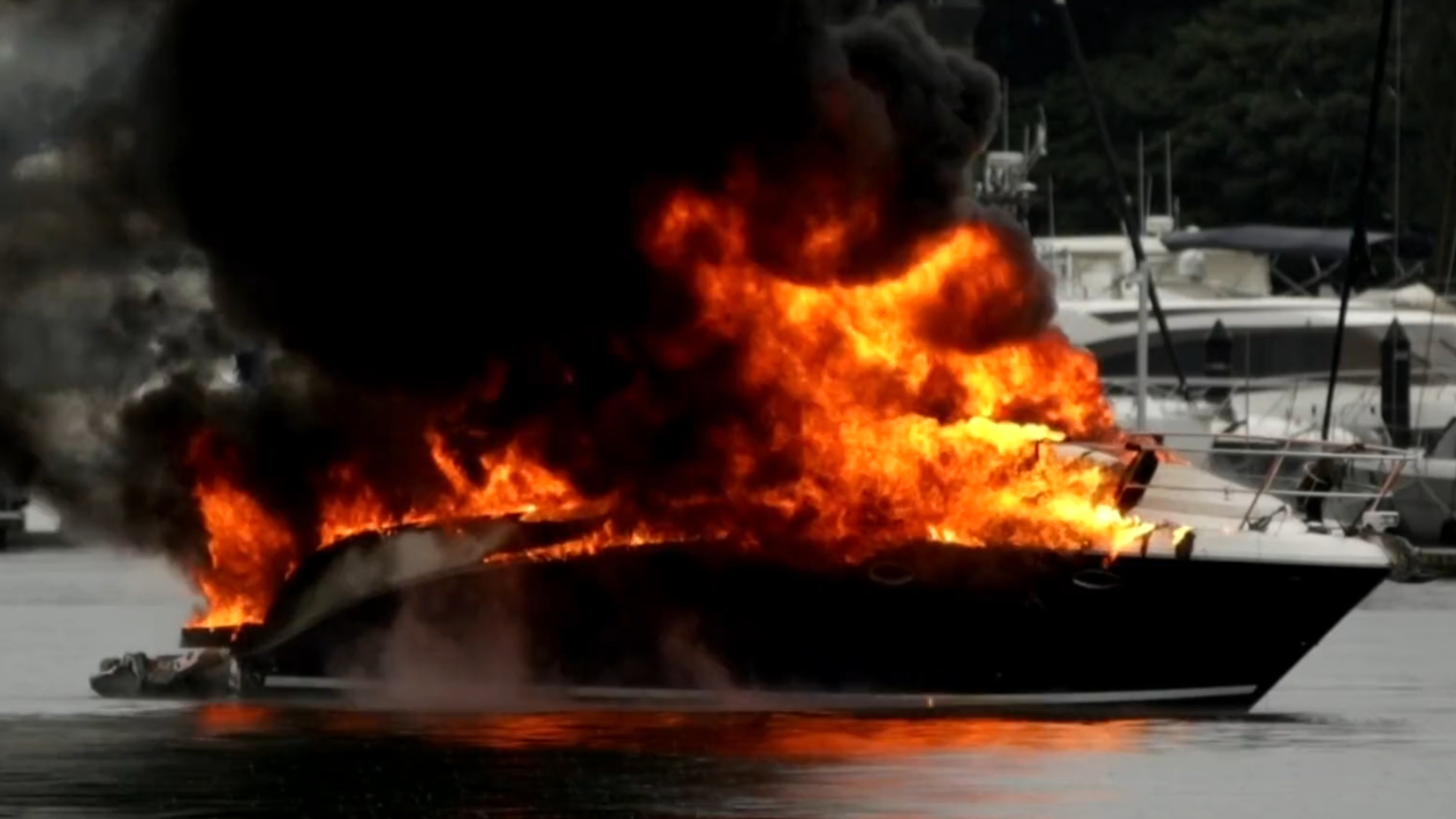 Crews rush to marina after yacht bursts into flames