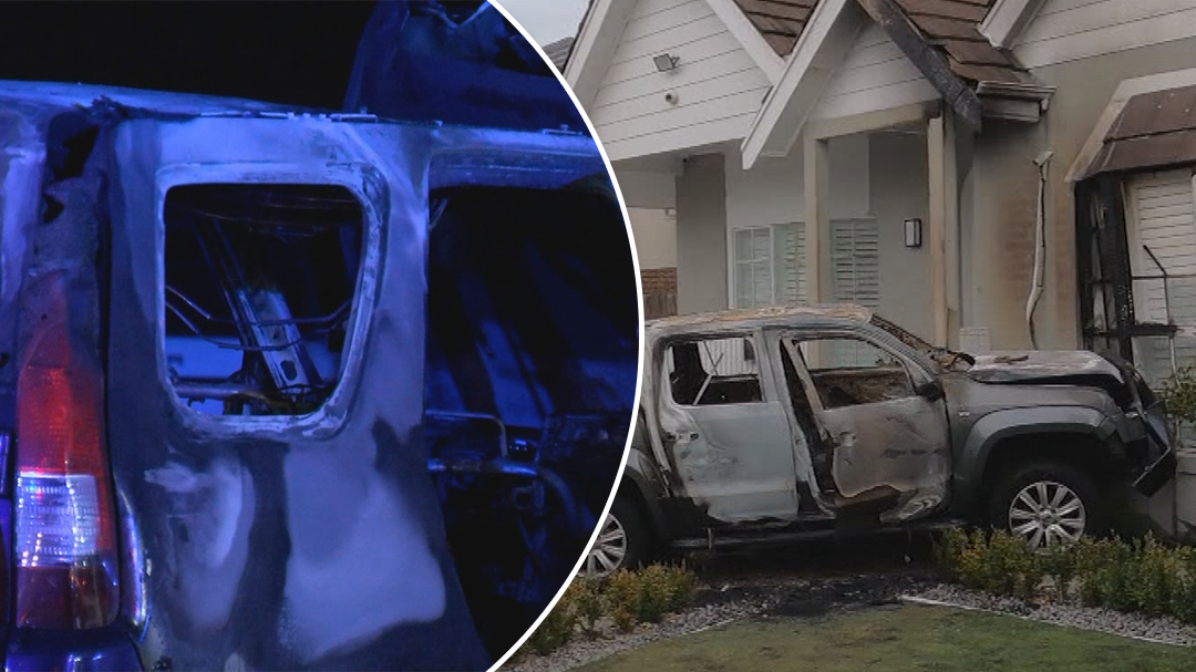 Two cars set alight and driven into Melbourne mansion overnight
