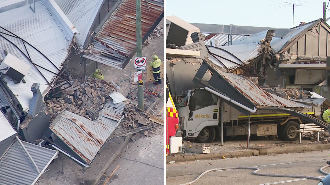 Driver trapped after truck crashes into Sydney house
