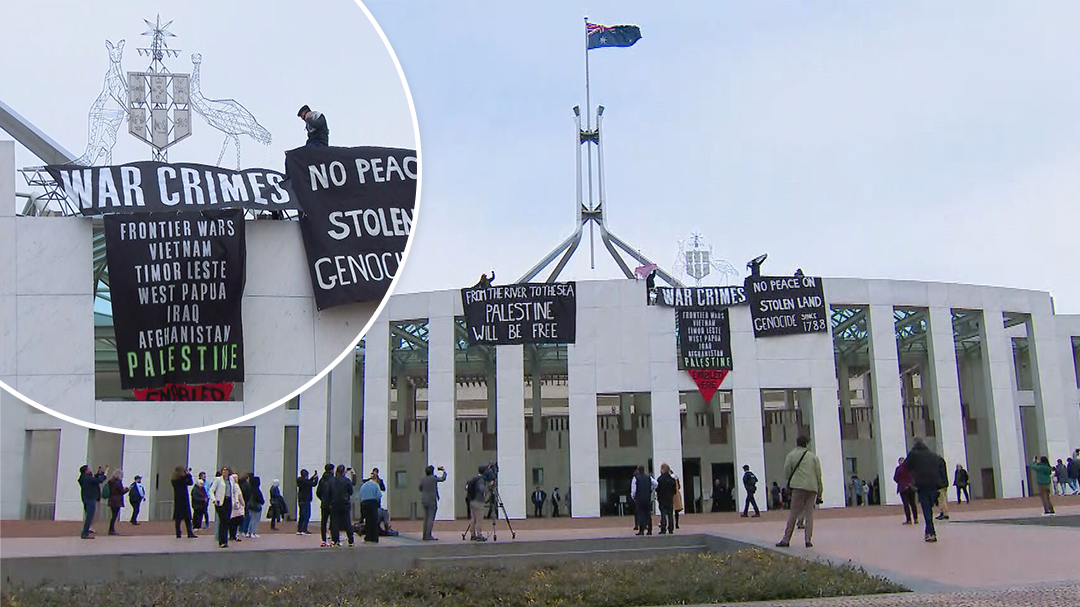 Protesters unfurl banners over Parliament House